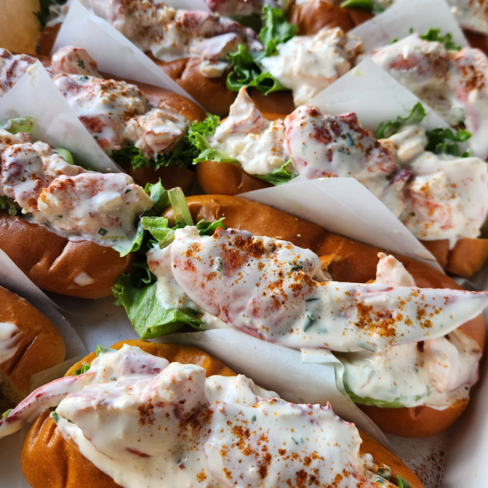 Close up of a platter of Maine lobster rolls for onboard catering provided by Pepperell Provisions.